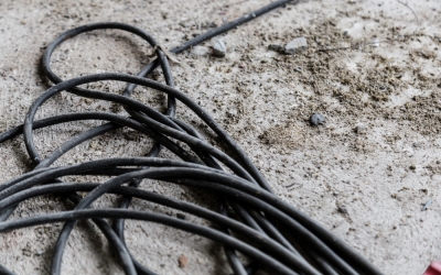 worn out cord on a dirty concrete floor