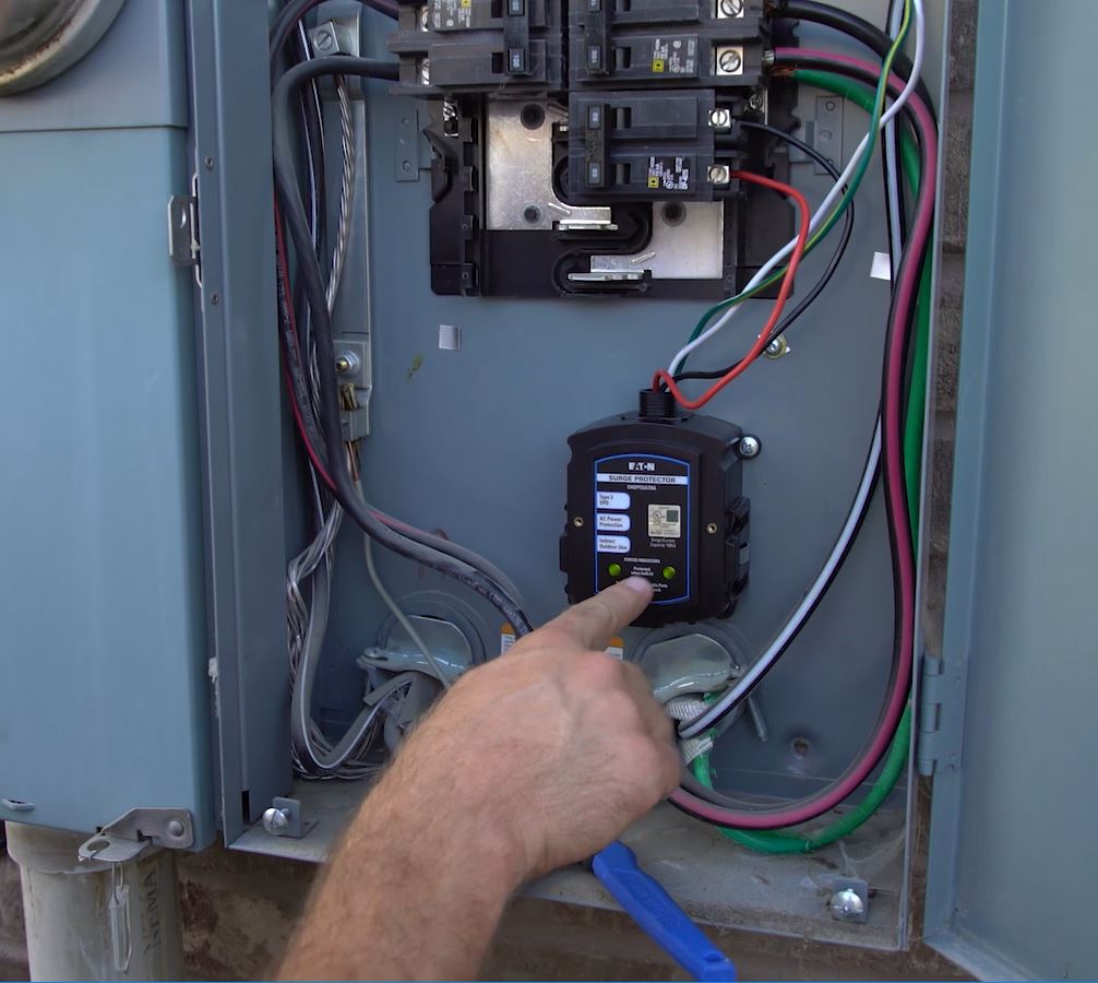 A whole home surge protector is installed in a panel.