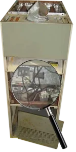 Old electric furnace with exposed wires, viewed through magnifying glass. The image conveys a sense of caution and need for repair.