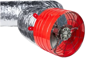 Shiny silver duct connected to a bright red inline ventilation fan with a protective black grill. The setup conveys industrial efficiency.