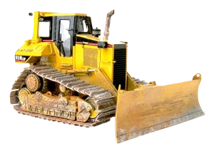 A yellow bulldozer with rugged tracks and a large front blade, displaying signs of rust and wear, conveying a sense of heavy-duty work and durability.