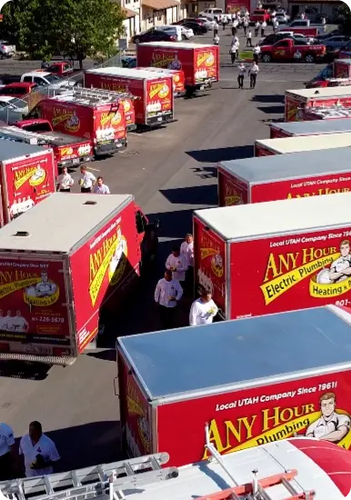 An arial perspective of a fleet of any hour services work trucks