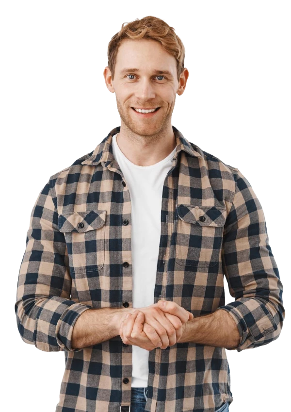 man in a white shirt and unbuttoned flannel smiling at the camera