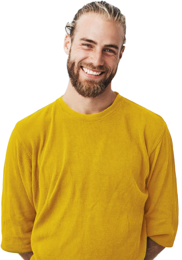 man in a yellow shirt smiling at the camera