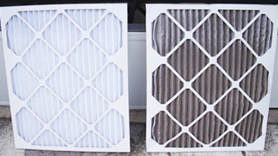 Two air filters side by side; the left furnace filter is clean and white, while the right filter is dirty and darkened with dust—a clear reminder of the importance of regular furnace maintenance.