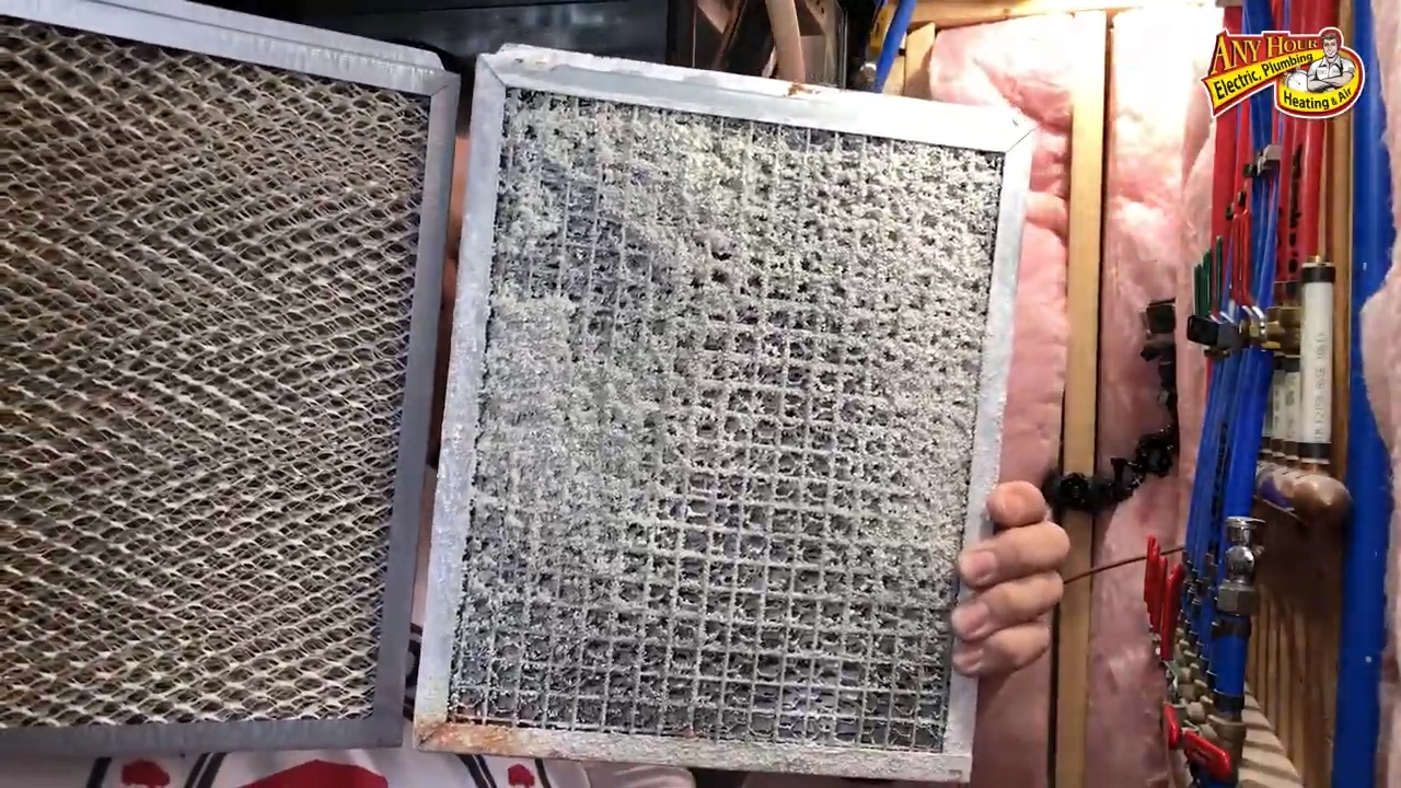 %Title% | Any Hour Services A person holds two air filters side by side; one is clean and the other is clogged with dust and debris, highlighting how proper home humidity helps protect your family from allergens.
