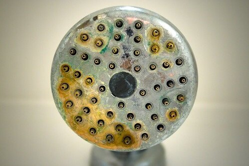 %Focuskw% | Any Hour Services Close-up of a metal showerhead with hard water mineral buildup and discoloration, common reasons Utah home owners install a water softener system.
