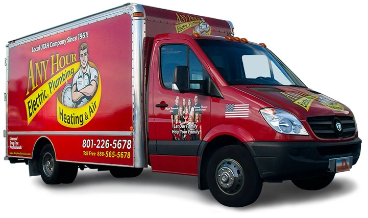 A red service van for Any Hour Electric, Plumbing, Heating & Air, featuring company branding, contact information, images of employees on its side, and a promotion for a Free Furnace.